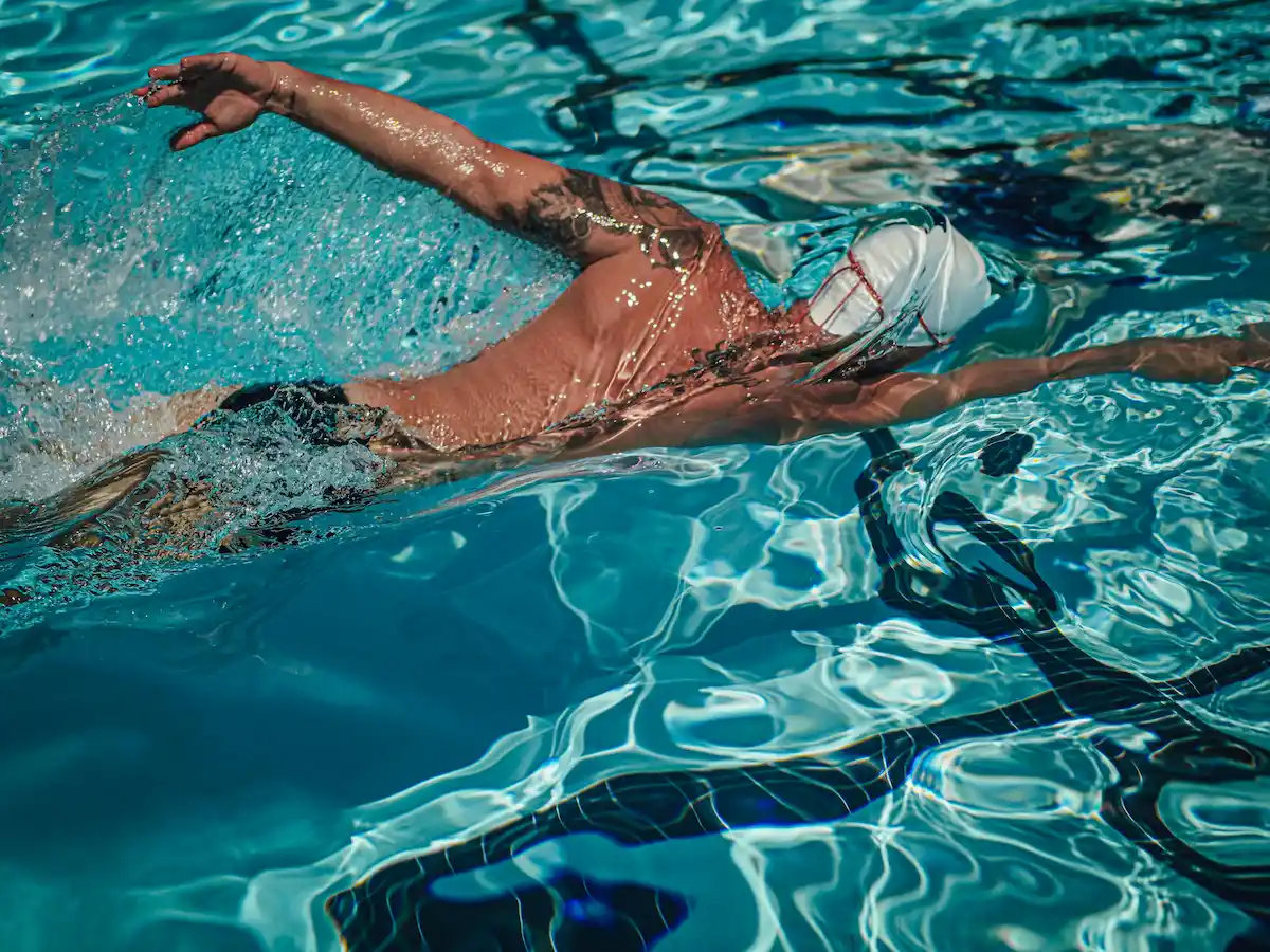 Swimmer training in pool lane, Hertfordshire